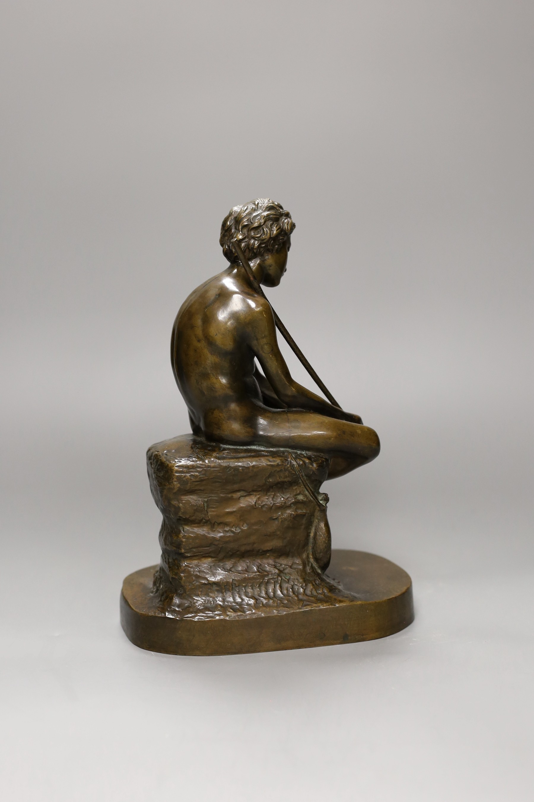 An early 20th century bronze figure of a fisherboy, 25cm